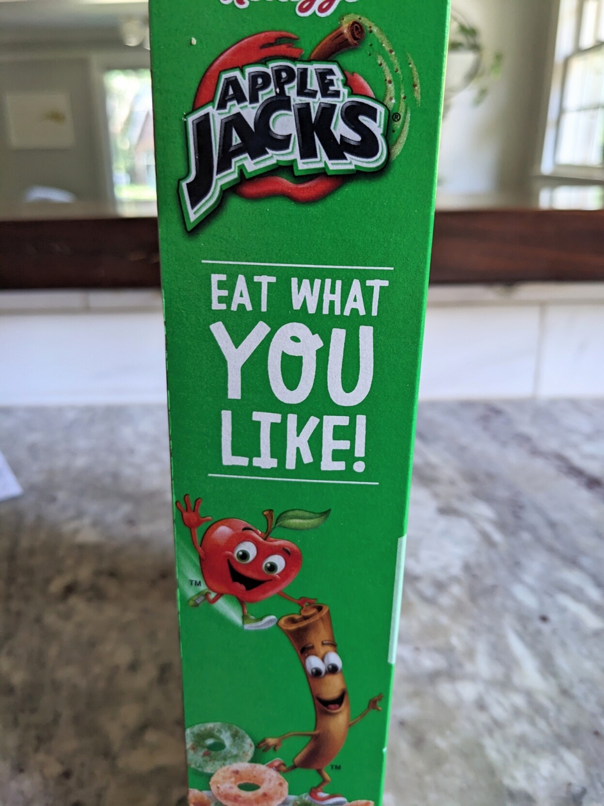 A photo of the side of an Apple Jacks cereal box that says "Eat what you like"