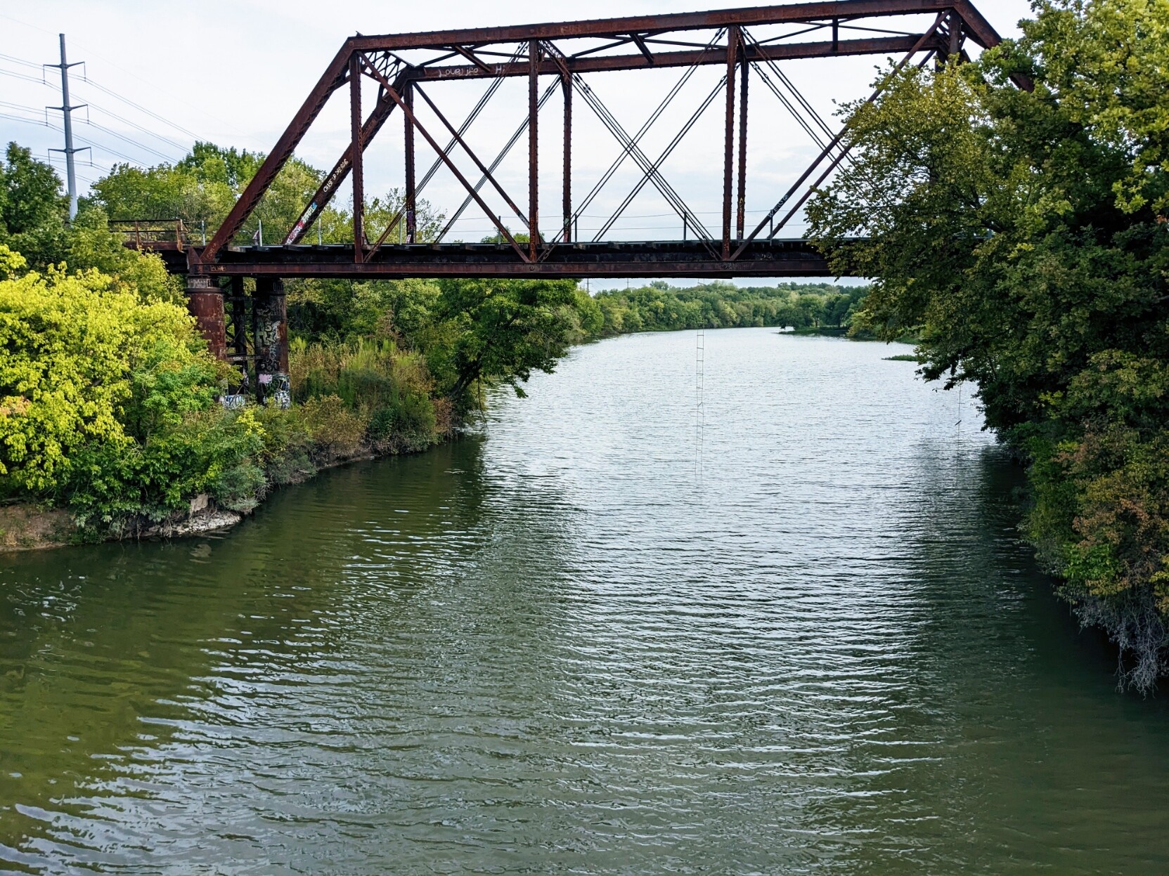 Photo of a train trestle bridge over a creek in Dallas TX