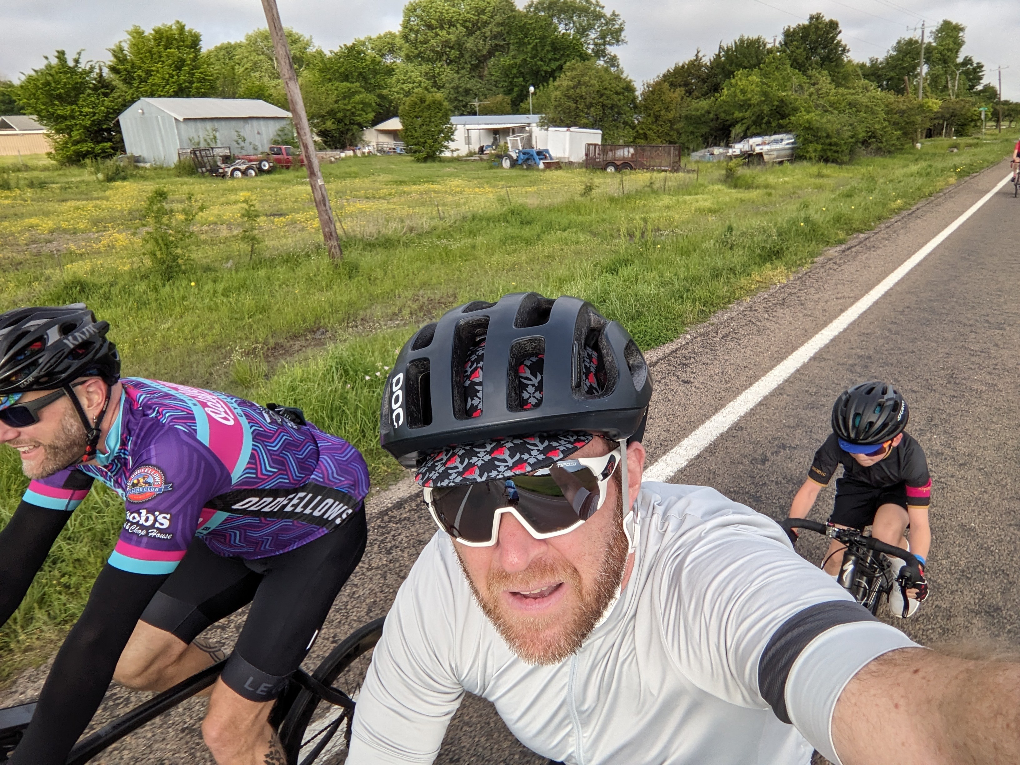 Selfie on the bike, with boy "sitting on the wheel" behind me.
