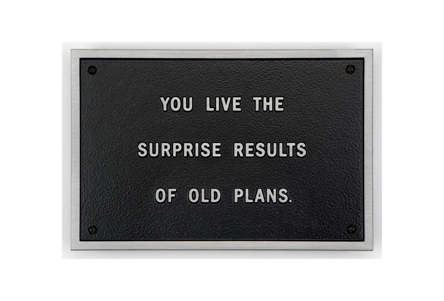 Cast aluminum plaque by Jenny Holzer: "You live the surprise results of old plans."