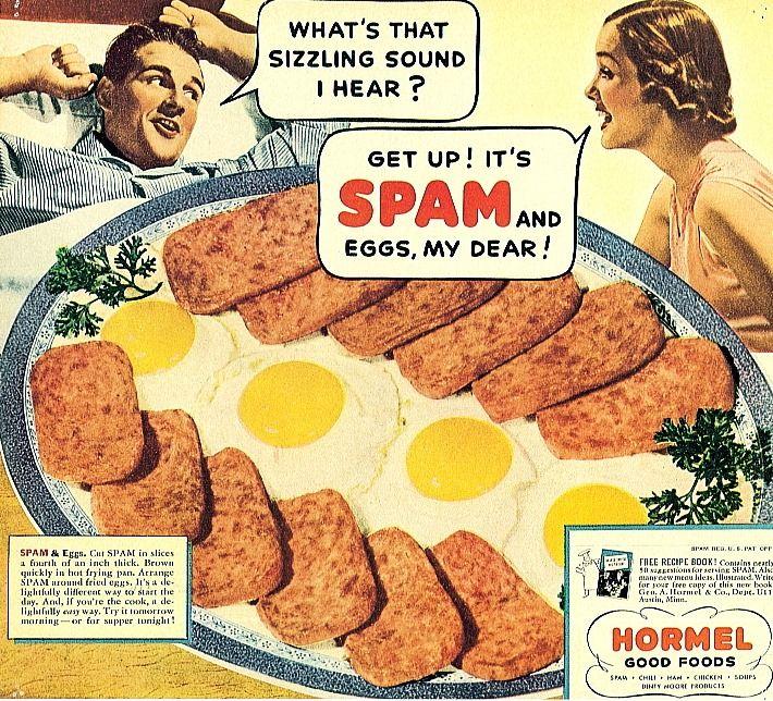 1930s–1940s style Hormel print advertisement featuring an illustrated woman calling to a smiling man in bed. Speech bubbles read: “What’s that sizzling sound I hear?” and “Get up! It’s SPAM and eggs, my dear!” The main image shows a large breakfast plate topped with several browned slices of Spam arranged around multiple sunny-side-up eggs